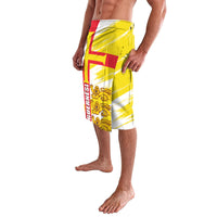 Yellow and white knee-length lavalava shorts with red cross and lion crest
