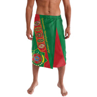 Green lavalava with red triangular panel and colorful emblem print, elastic waist