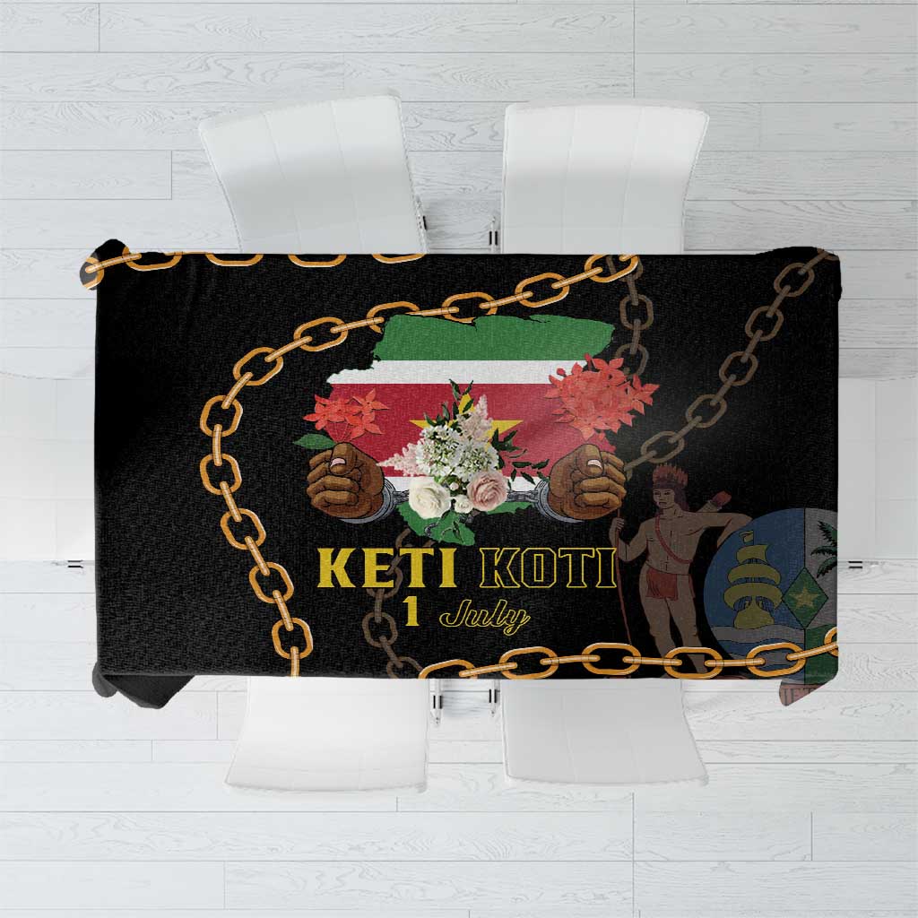 Black tablecloth with gold chain border and colorful Keti Koti graphic center