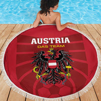 Red round football beach blanket with white fringe featuring Austria team crest