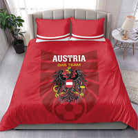 Red Austria football bedding set with two striped pillows and large crest graphic on duvet.