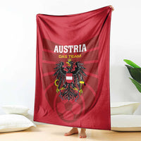 Red Austria team football blanket with Austria Das Team lettering and crest, hanging