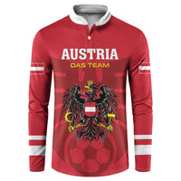 Red football button sweatshirt with white striped sleeves and Austria front crest graphic