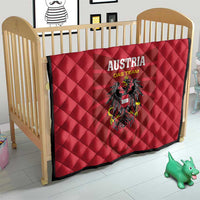Red quilt blanket with 'AUSTRIA DAS TEAM' text and black eagle crest, quilted