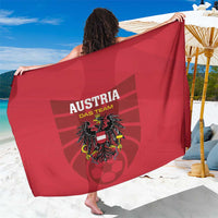 Red Austria football team sarong with crest graphic and bold lettering