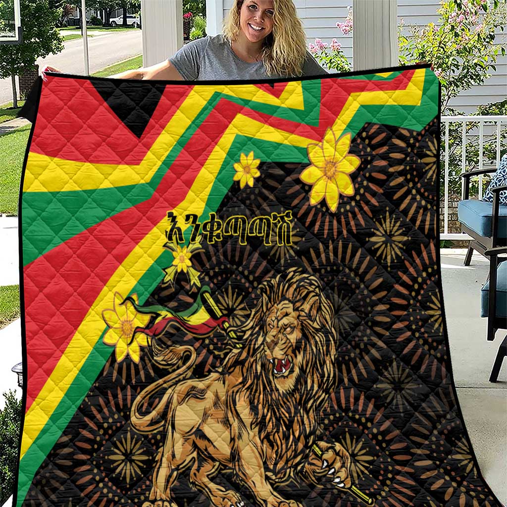 Black quilt with colorful Ethiopian pattern, lion of Judah and yellow flower accents