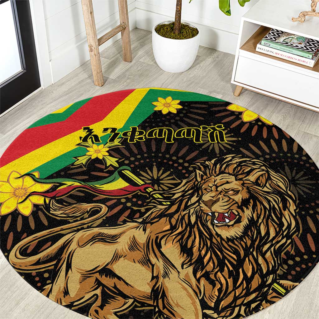 Round black lion area rug with green, red, yellow stripes and flower accents