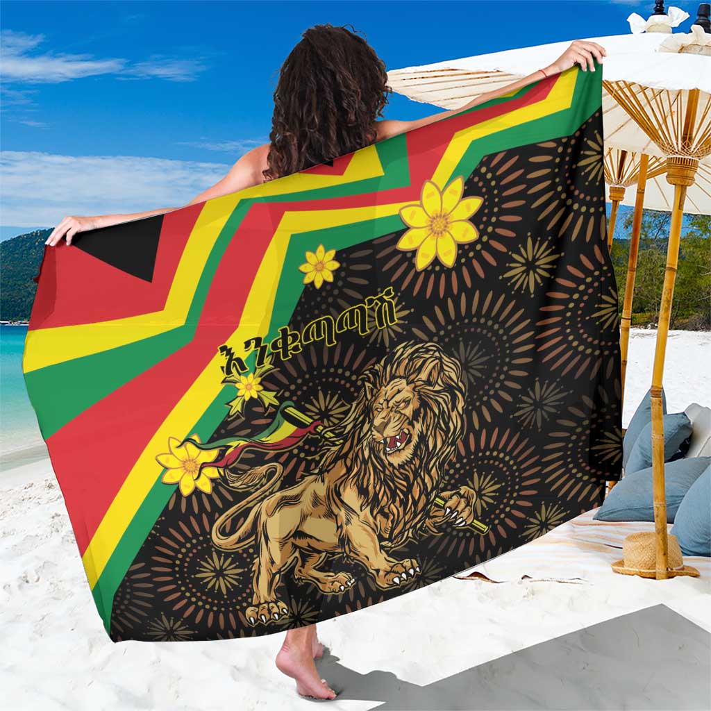 Black lion of Judah sarong with yellow flower motifs and red green geometric bands