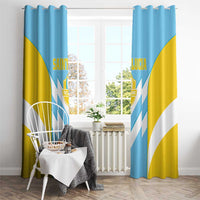 Saint Lucia window curtain with metal ring top, blue/yellow with white chevrons and crest.