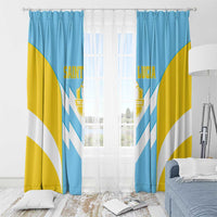 Saint Lucia window curtain with ring top, blue/yellow panels with white chevrons and crest.