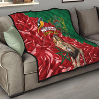 Moroccan themed quilt draped on sofa, red and green flag with lion portrait and Morocco lettering