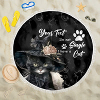 Black round beach blanket with cat illustration and 'I'm not Single' text, fringed edge