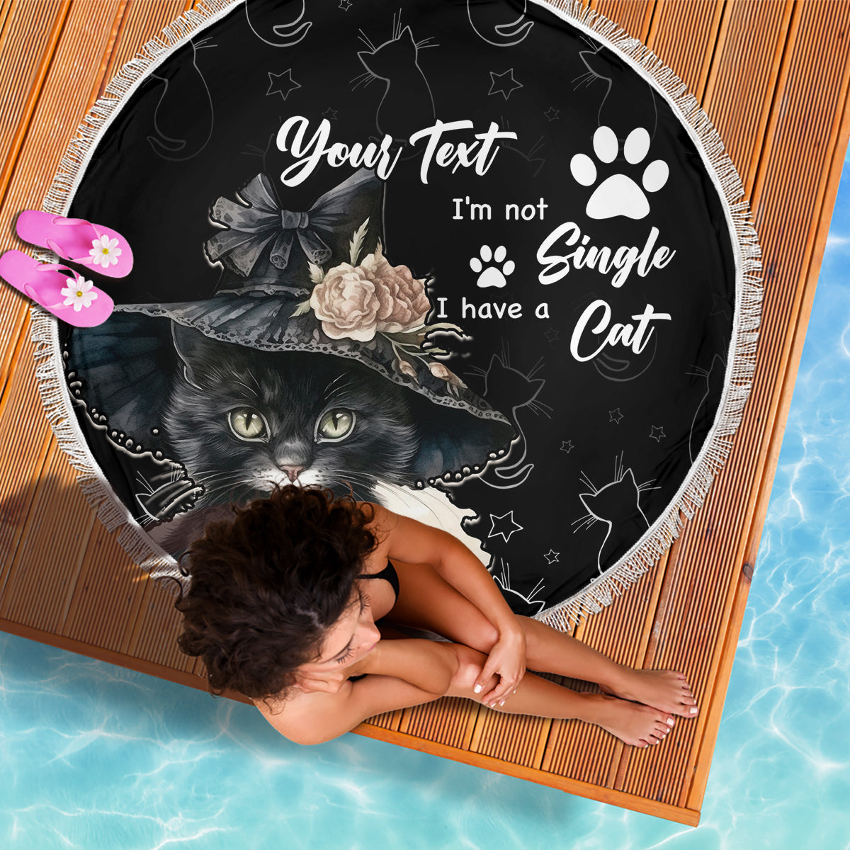 Black round beach blanket with cat illustration, paw prints and 'I have a Cat', fringed edge