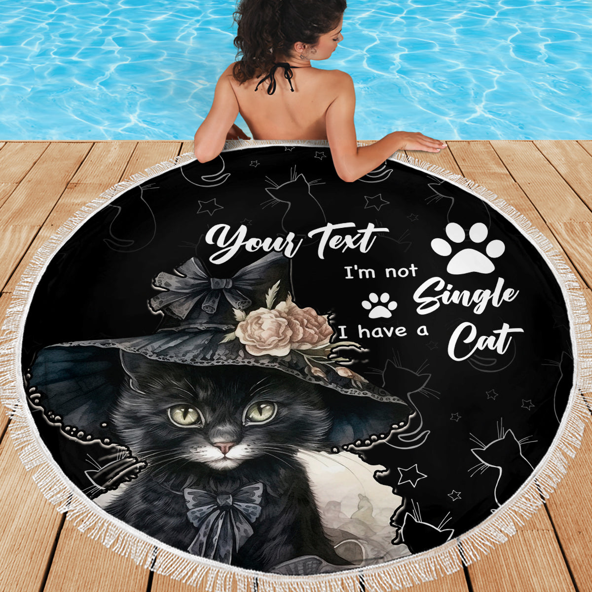Black round beach blanket with cat portrait and paw prints, white fringed border