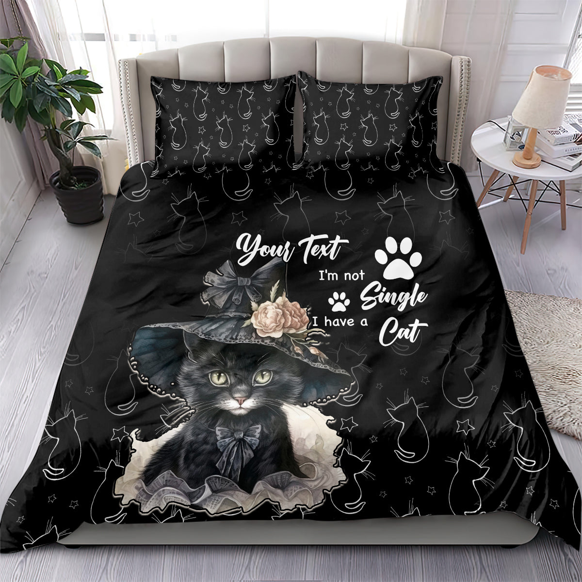 Black bedding set with cat portrait graphic, paw-print motif, and matching pattern