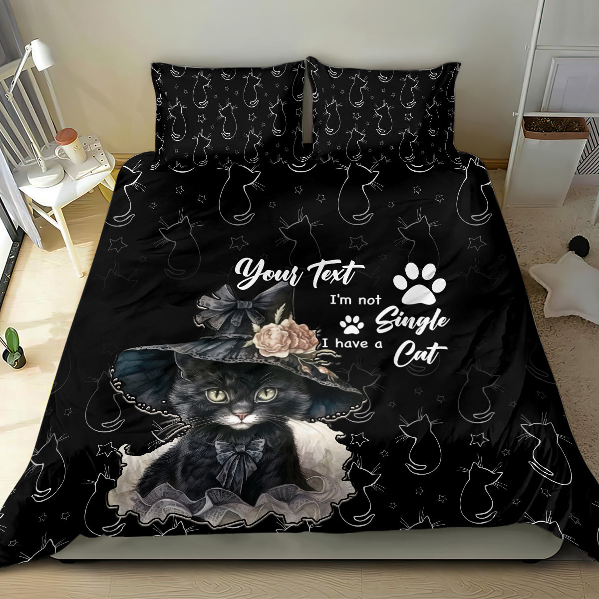 Black cat-themed bedding set with cat portrait graphic, paw prints, and star accents