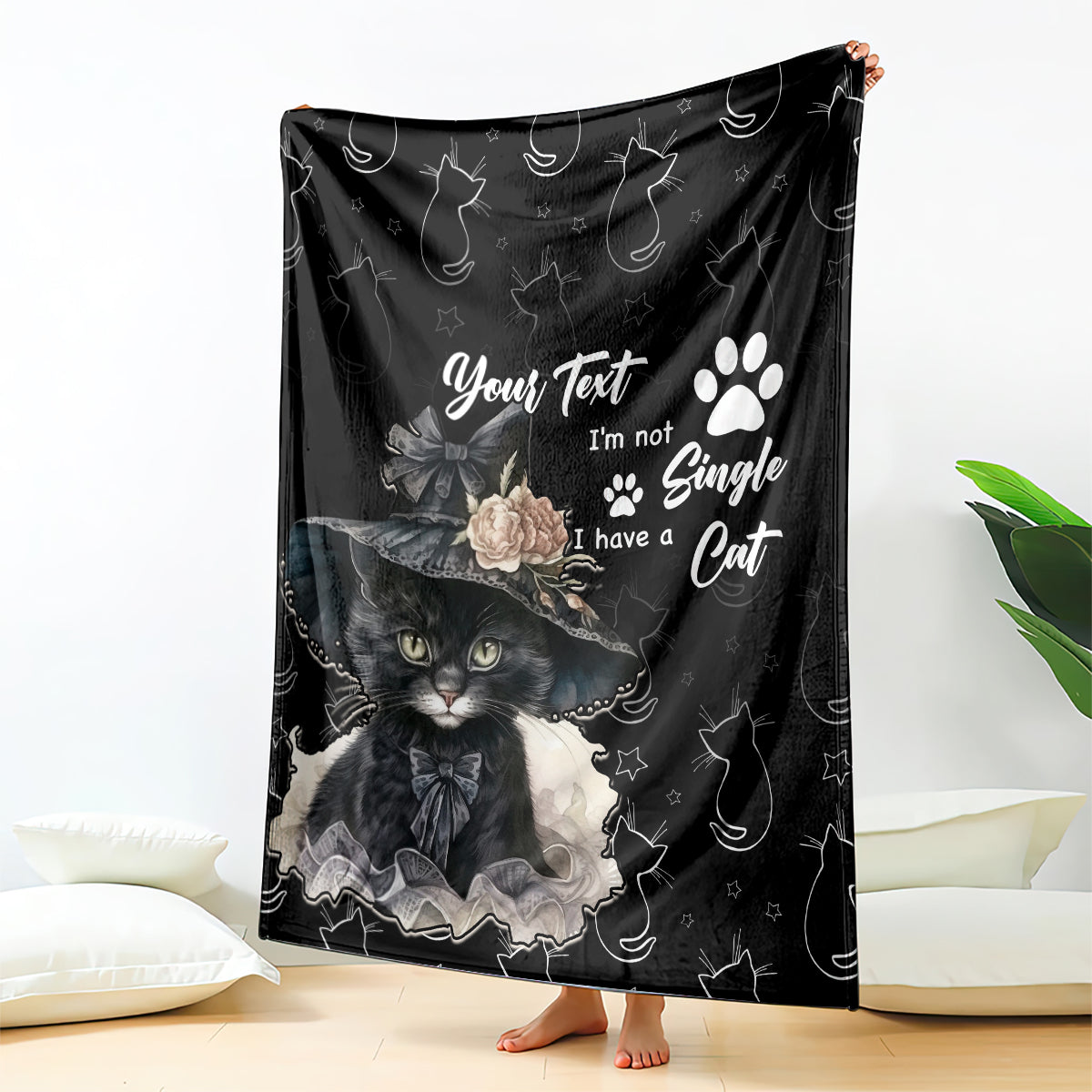 Black cat-themed blanket with paw print and whimsical cat illustration