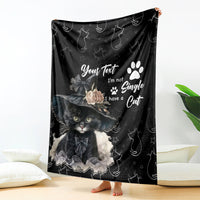 Black cat-themed blanket with paw print and whimsical cat illustration