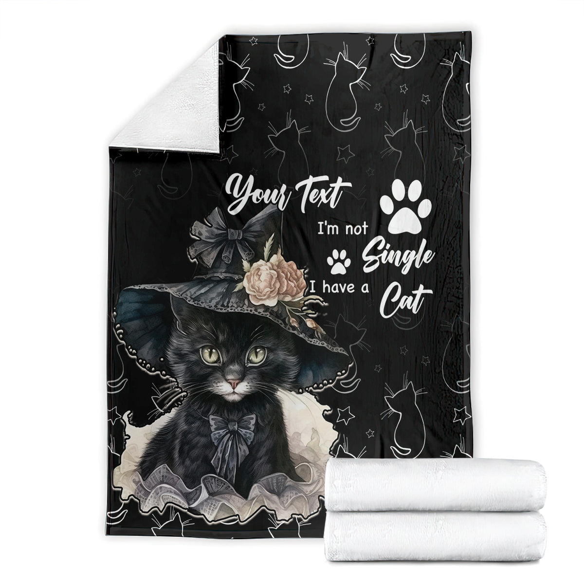 Black cat-themed blanket folded with paw print, roses, and cat portrait artwork