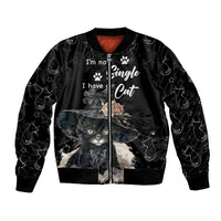 Unisex black bomber jacket with cat graphic and paw prints, front zipper