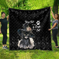 Black quilt blanket featuring gray cat artwork, paw prints, and decorative text in center