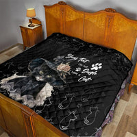 Black cat quilt blanket on bed, showing gray cat image and decorative text with paw icon