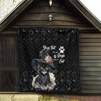 Black quilt blanket hanging outdoors, with gray cat graphic, paw print, and star accents
