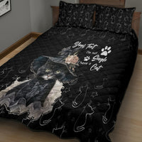 Black quilt bed set with cat portrait graphic, stars, and paw-pattern details