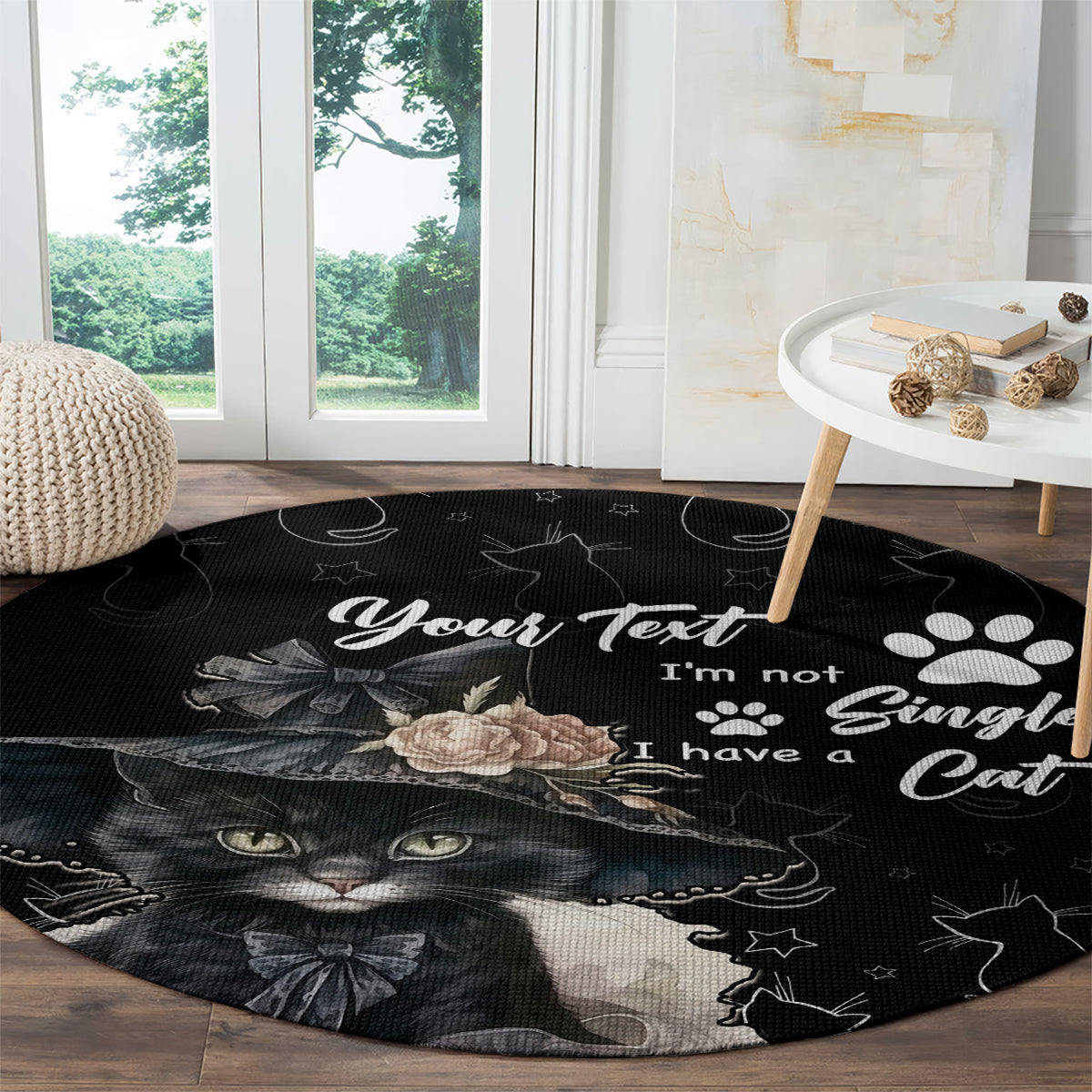 Black round cat carpet with cat face, star doodles, paw prints, and rose accents