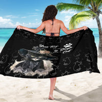 Black cat-themed sarong draped over shoulders with cat portrait and paw-print pattern