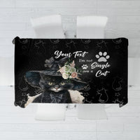 Black cat-themed tablecloth with cat face, stars, and paw prints graphic
