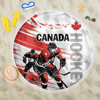 Round red and white hockey beach blanket with CANADA text, players, and fringe edge