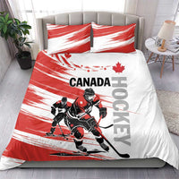 Canada hockey bedding set on bed: red/white duvet and two pillows with hockey players and flag