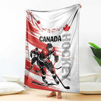 Canada hockey blanket draped floor-to-sofa with Canada text, hockey players, maple leaves