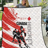 Red and white Canada hockey quilt with diamond stitching and black hockey player graphic