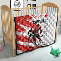 Red and white Canada hockey quilt on a crib with diamond stitching and hockey player graphic