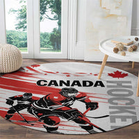 Round hockey rug with Canada text, maple motif, and player action graphic
