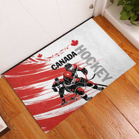 Canada hockey rubber doormat in red and white, featuring ice hockey players and maples