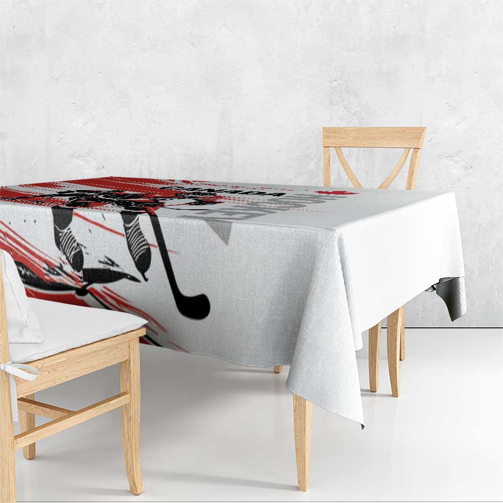 Red and white hockey-themed tablecloth covering bench table with overhang