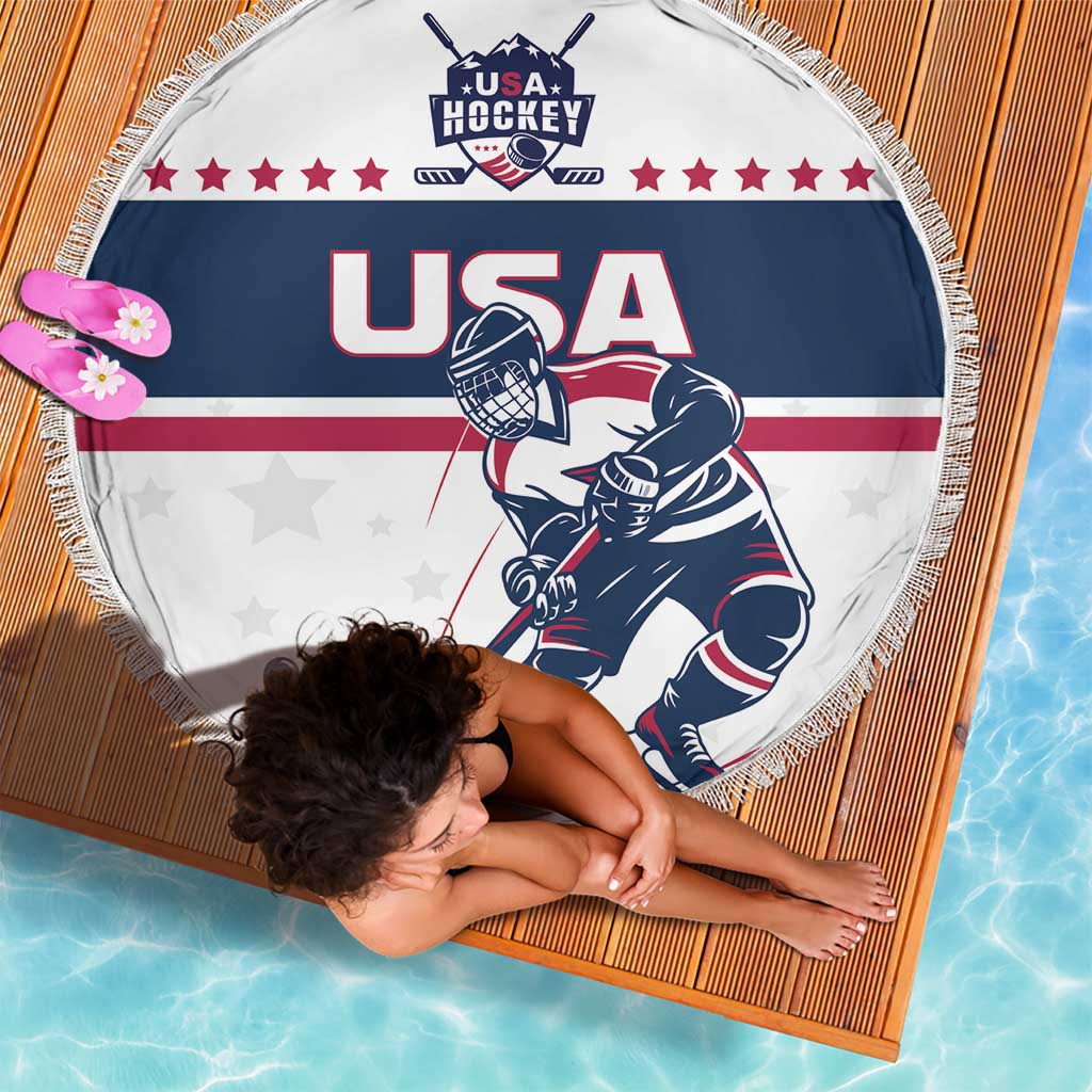 Round beach blanket with fringe, USA Hockey emblem, red stars, navy stripes, player illustration