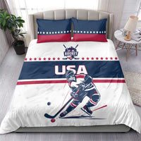 USA hockey bedding set on bed: blue/white duvet with red star border and two pillows