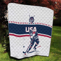 USA ice hockey quilt laid flat outdoors with navy center stripe, stars, and hockey player art