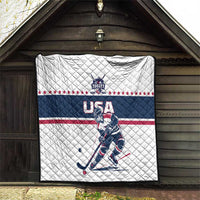 USA ice hockey quilt hanging in a shed: white diamond quilting with navy and red stripe design