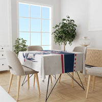 White ice hockey tablecloth draped on dining table, USA stars, navy stripe and hockey graphic