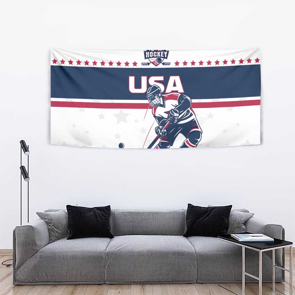 USA ice hockey tapestry over gray couch, with hockey player art, stars, and red white blue stripes
