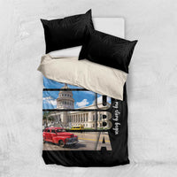 Black bedding set with blue-sky building and red car print; includes two black leaf pillows