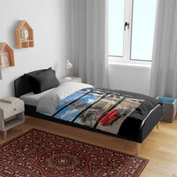 Black duvet cover set on bed, showing blue sky building and red car print with two black pillows