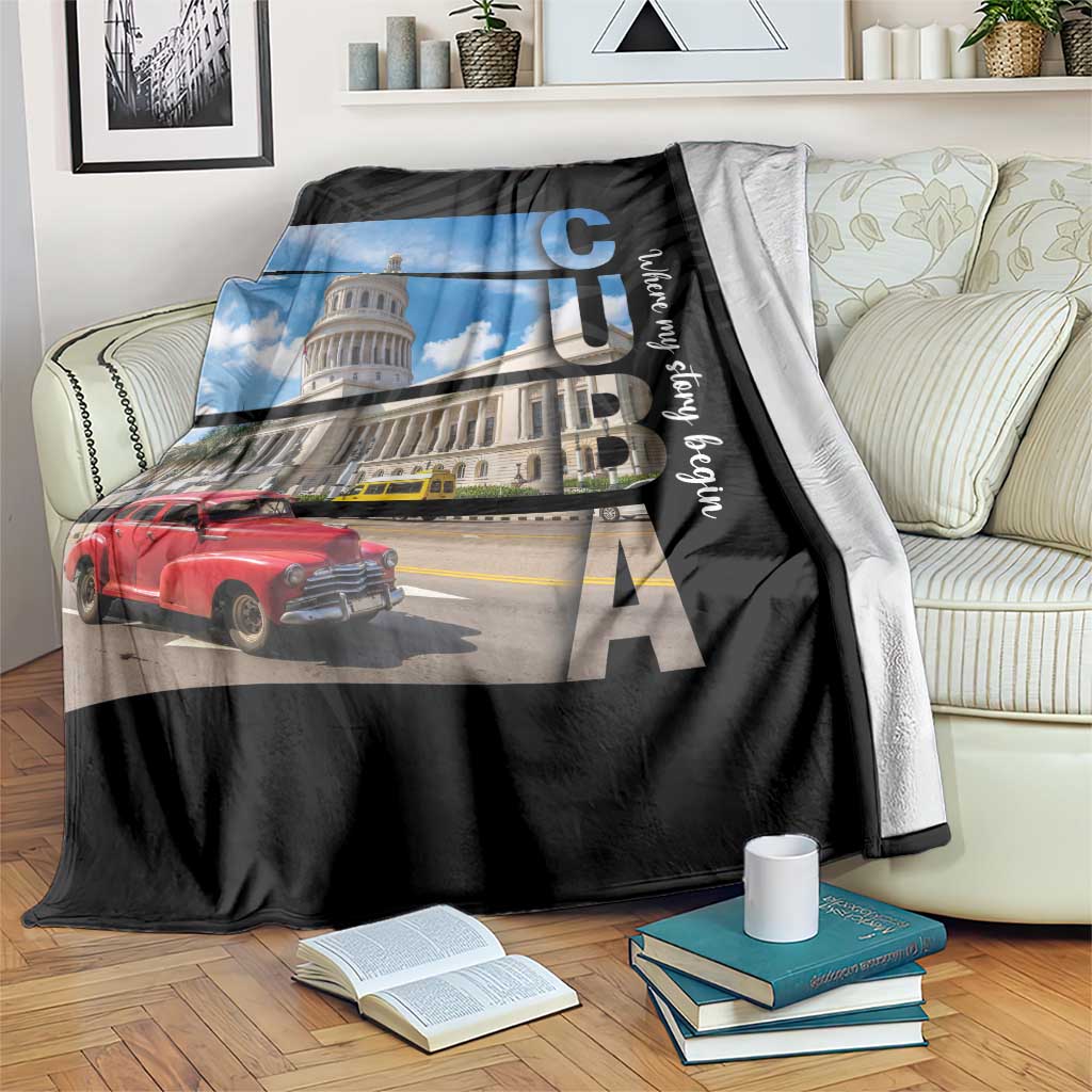 Black printed blanket with blue sky city landmark, red car, and large letters