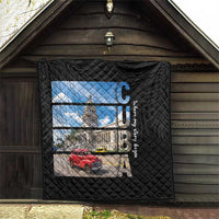 Black quilt hanging on wall with diamond quilting and Cuba capitol image and red car