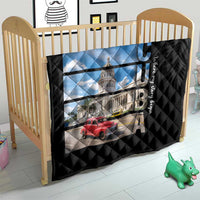 Black quilt on wooden crib with diamond quilting and Cuba capitol building and red car